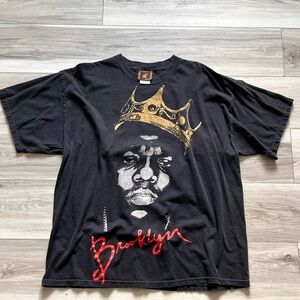 Black Graphic T-Shirt with Gold and Red Accents